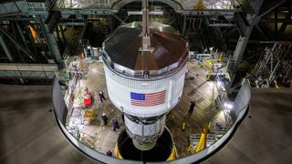 The Interim Cryogenic Propulsion Stage being lowered atop the Space Launch System rocket at the NASA Kennedy Space Center in Florida.