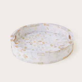 A round mother of pearl inlaid tray