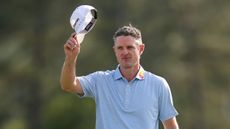 Justin Rose tips his cap to the crowd at The Masters