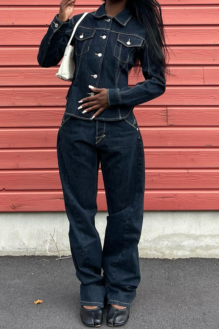 a woman wearing a denim jacket, jeans and tabi flats