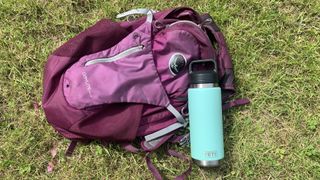 Yeti Rambler bottle next to a backpack for scale