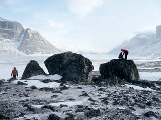 University at Buffalo students (left to right) Elizabeth Thomas, Sean McGrane and Nicolás Young study the historical extent of glaciers on Baffin Island.