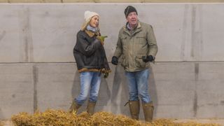 Jeremy Clarkson and Lisa Hogan standing next to a pile of hay in Clarkson's Farm season 2
