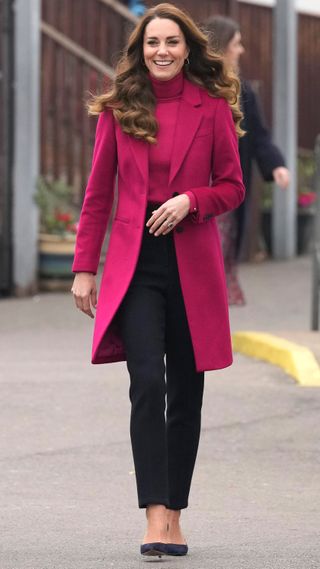 Catherine, Princess of Wales smiles as she arrives for a visit to Nower Hill High School on November 24, 2021