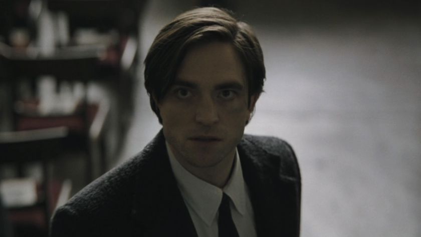 Bruce Wayne staring up during funeral in The Batman