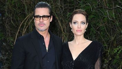 london, united kingdom may 08 brad pitt and angelina jolie attends a private reception as costumes and props from disneys maleficent are exhibited in support of great ormond street hospital at kensington palace on may 8, 2014 in london, england photo by fred duvalfilmmagic