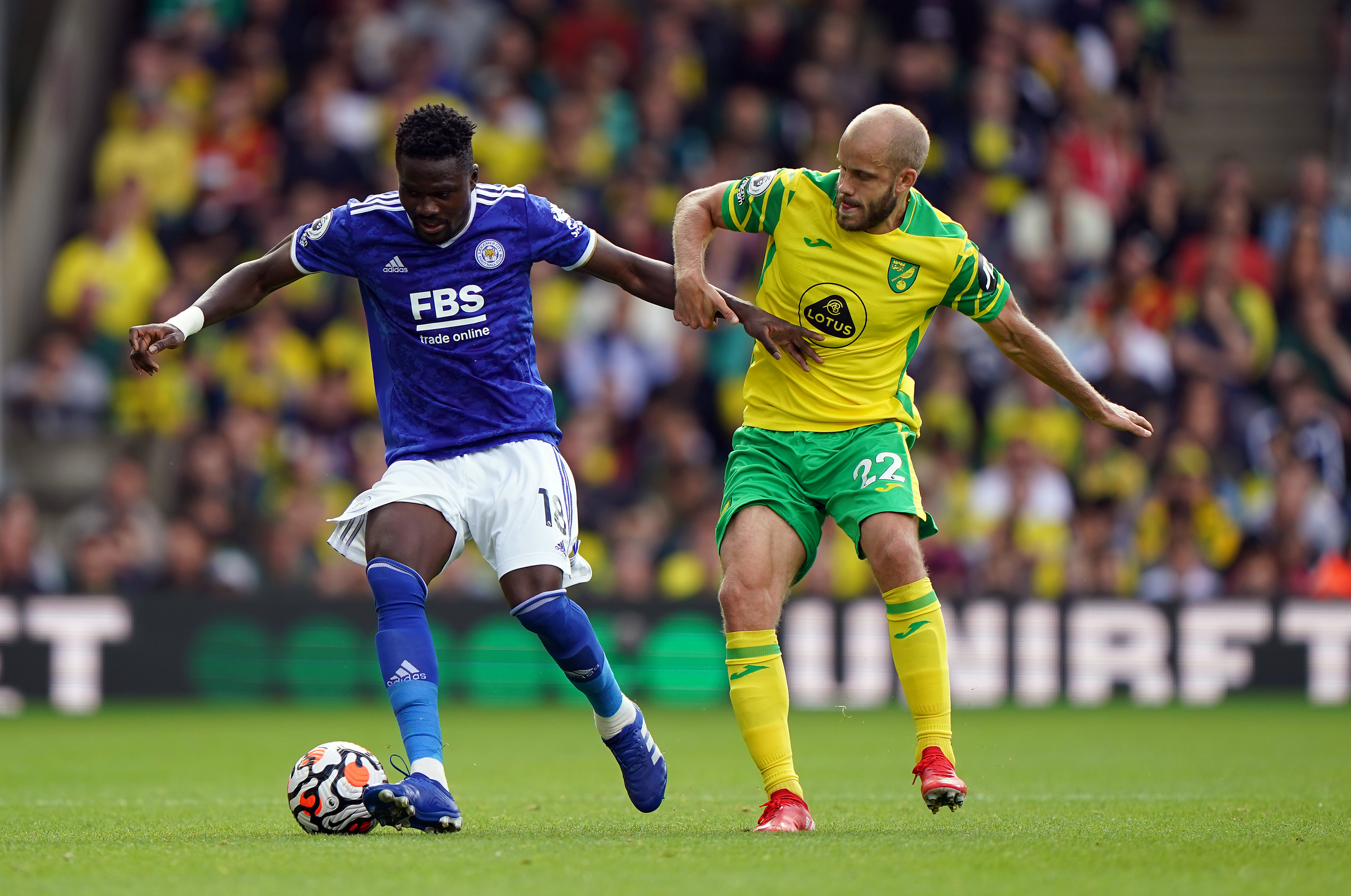 Leicester City’s Daniel Amartey (left) and Norwich City’s Teemu Pukki battle for the ball during the Premier League match at Carrow Road, Norwich. Picture date: Saturday August 28, 2021