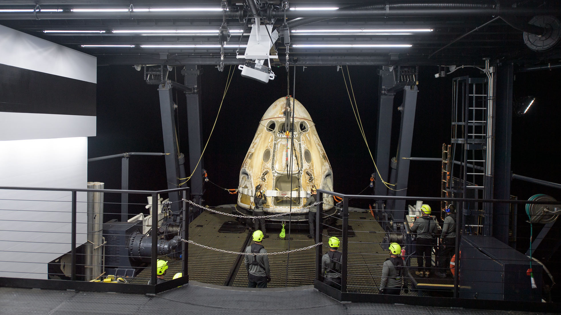 Support teams work around the SpaceX Crew Dragon Resilience spacecraft shortly after it splashed down in the Gulf of Mexico on May 2, 2021.