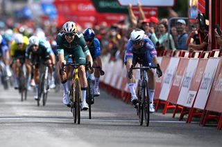 VILLABLINO SPAIN AUGUST 31 LR Wout van Aert of Belgium and Team Visma Lease a Bike Green Points Jersey and stage winner Kaden Groves of Australia and Team Alpecin Deceuninck sprint at finish line during the La Vuelta 79th Tour of Spain 2024 Stage 14 a 2005km stage from Villafranco del Bierzo to Villablino UCIWT on August 31 2024 in Villablino Spain Photo by Dario BelingheriGetty Images