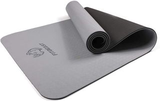 FitBeast thick gray yoga mat, partially rolled up