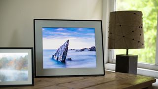 Aura Walden digital photo frame on a wooden sideboard