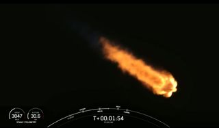 A SpaceX Falcon 9 rocket carrying 60 Starlink internet satellite soars toward orbit on Feb. 15, 2021.