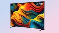 The Vizio 4K TV on a pink background.