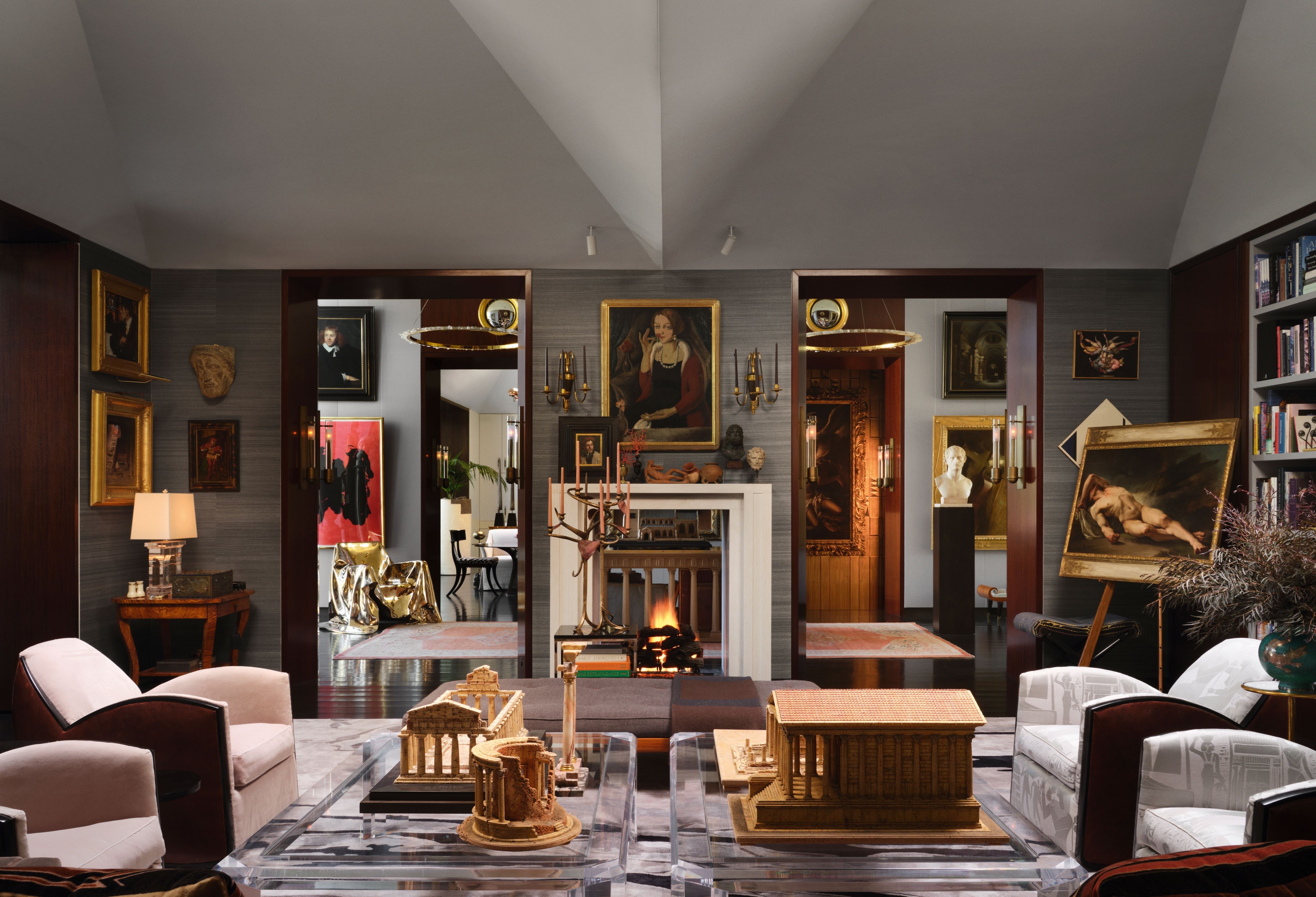 interior of a packed living room full of artwork and design objects, in a lush Las Vegas house