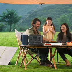 Family sitting outside with a Portable Power Station on the table sold at Bluetti 