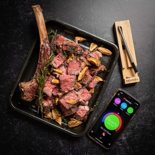 Meater Thermometer being used with a pan of rib-eye steak