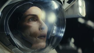 Noomi Rapace dressed as an astronaut in Constellation
