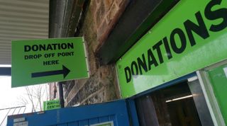 Sign for donations at Emmaus centre