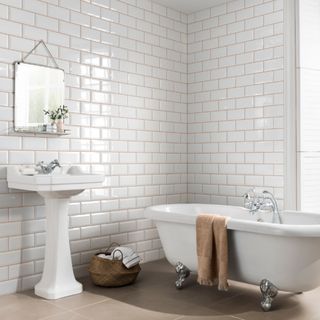 bathroom with white tiles and bathtub