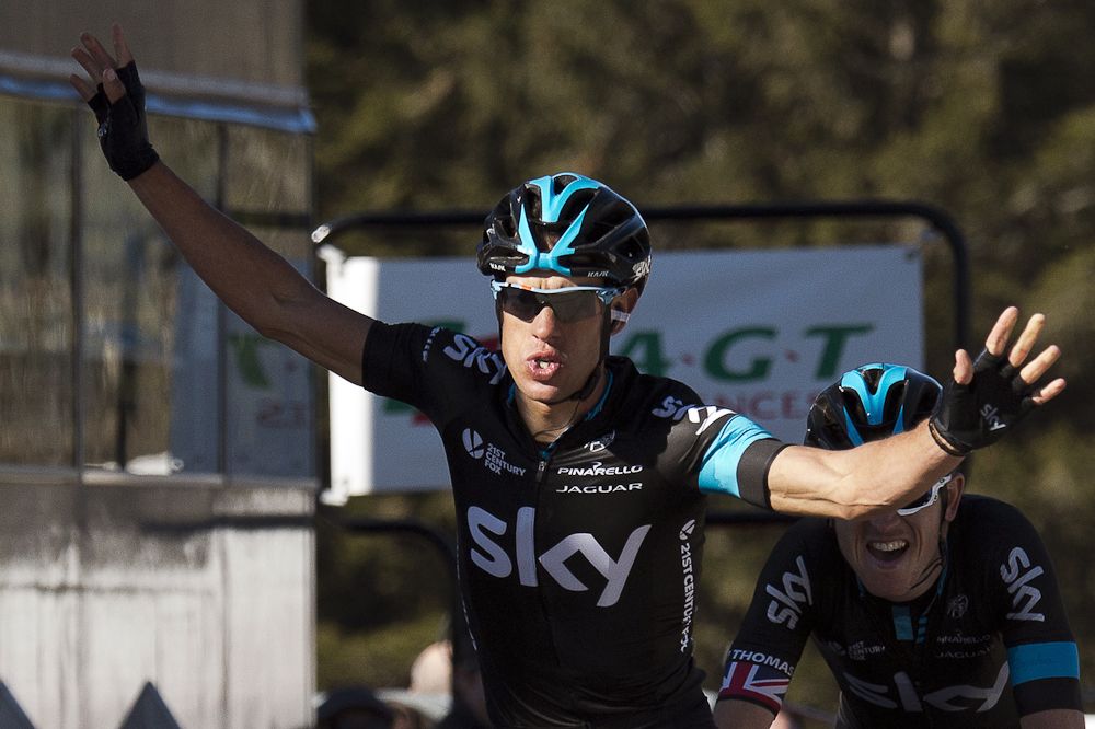 Australia's Richie Porte celebrates as he crosses the finish line, ahead of Great Britain's Geraint Thomas, at the end of the fourth stage.