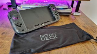 CRKD Nitro Deck+ next to its carrying pouch