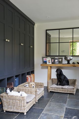 boot room with fitted furniture and dog beds