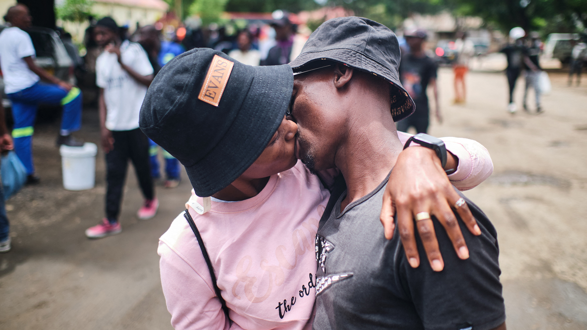 A man kisses his wife after being freed from prison as part of a presidential amnesty aimed at easing prison overcrowding in Bulawayo, Zimbabwe