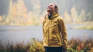 waterproof a jacket: hiker smiling in the rain