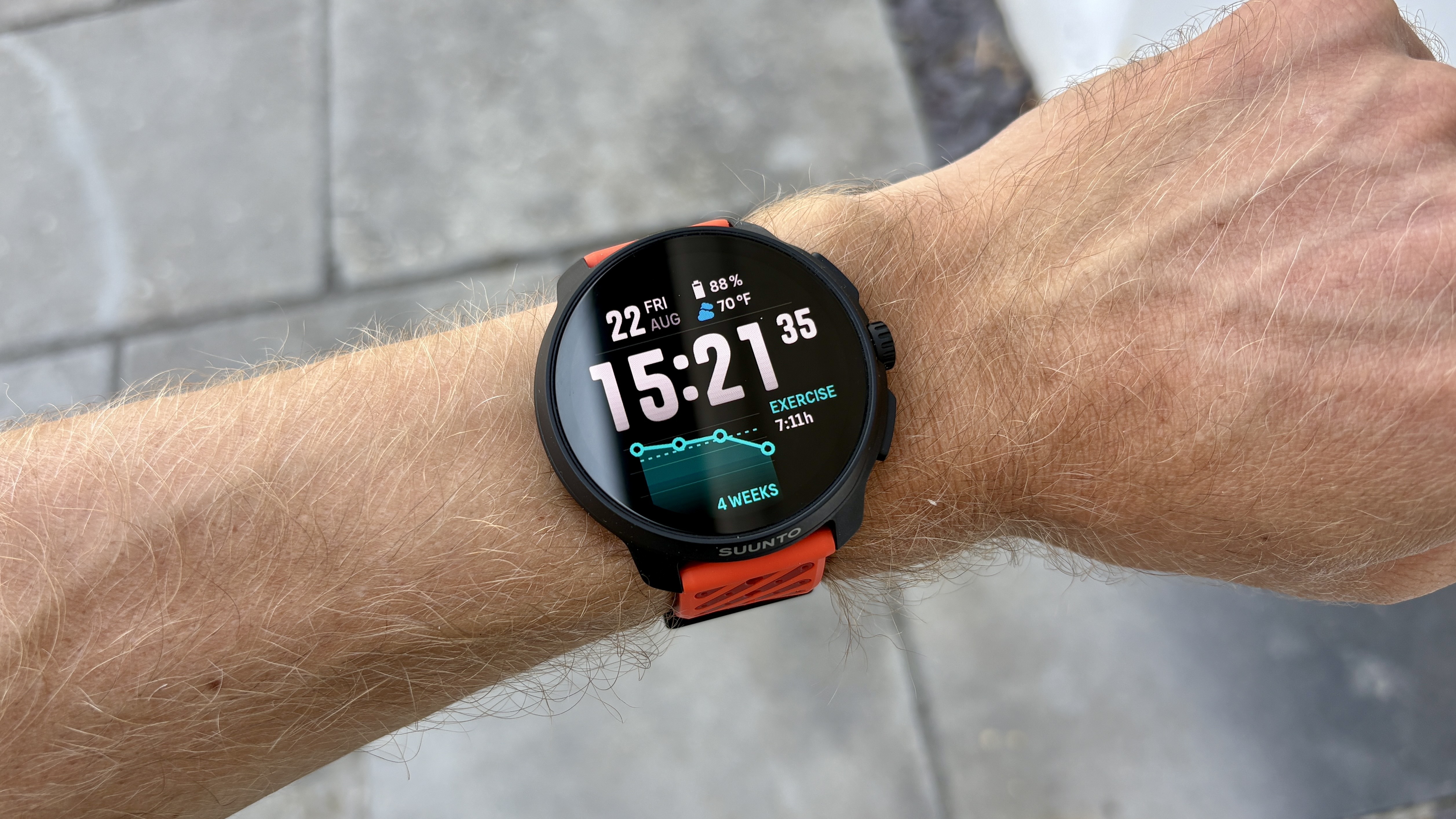 Suunto Race 2 on a person&#039;s wrist outside