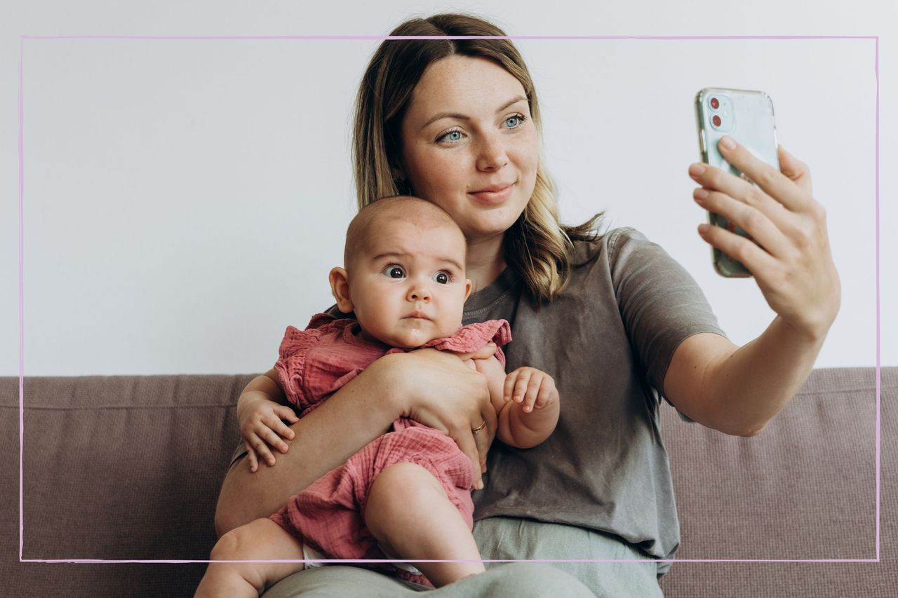 New mum taking a picture with her baby