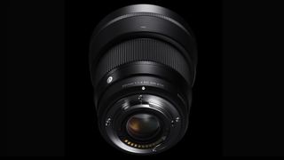 Sigma 56mm f/1.4 DC DN Contemporary lens against a black background