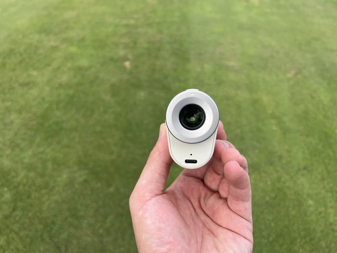 The lens and charging port on the Laser Fit