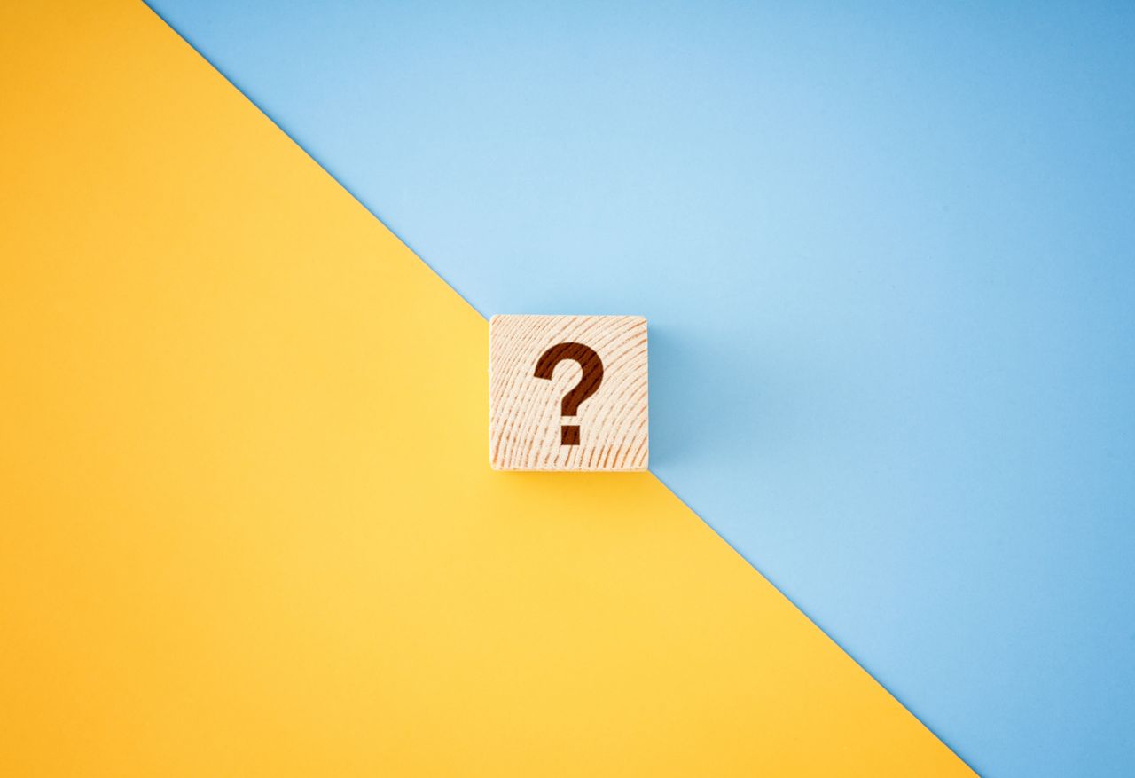 question mark block against a split yellow-and-blue background