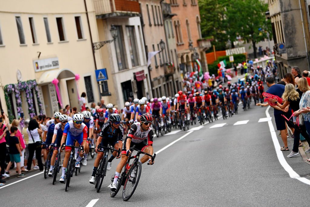 TREVISO ITALY MAY 26 A general view of Diego Ulissi of Italy and UAE Team Emirates and the peloton competing in the breakaway through Pieve di Soligo city landscape while fans cheer during the 105th Giro dItalia 2022 Stage 18 a 156km stage from Borgo Valsugana to Treviso Giro WorldTour on May 26 2022 in Treviso Italy Photo by Tim de WaeleGetty Images