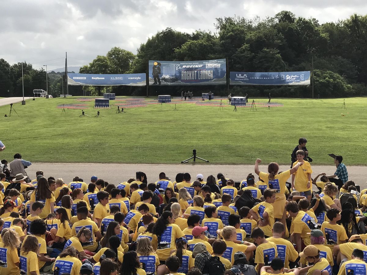Space Camp participants in yellow and nearly 2,500 onlookers await the launch of 5,000 model rockets on the 50th anniversary of the Apollo 11 moon mission launch at the U.S. Space &amp; Rocket Center in Huntsville, Alabama on July 16, 2019.