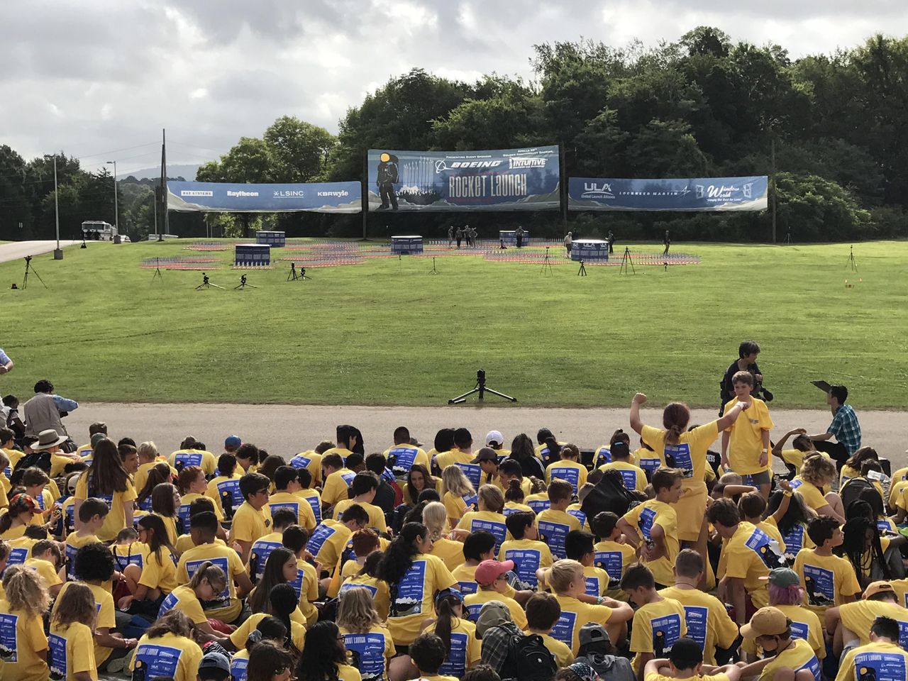 Space Camp participants in yellow and nearly 2,500 onlookers await the launch of 5,000 model rockets on the 50th anniversary of the Apollo 11 moon mission launch at the U.S. Space &amp; Rocket Center in Huntsville, Alabama on July 16, 2019.