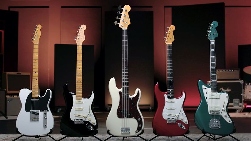 Five Fender American Vintage Series ii guitars standing side by side against a rehearsal room backdrop