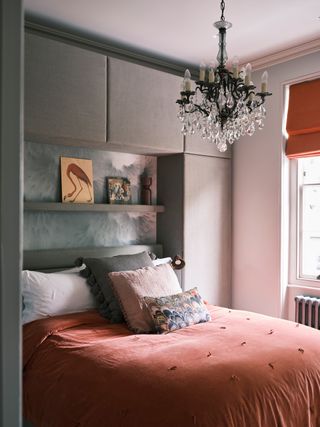 Small bedroom with chandelier
