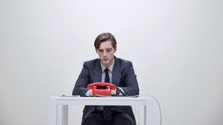 Martin Rauch (Jonas Nay) waits for the phone to ring