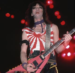 Vinnie Vincent performs onstage with Kiss
