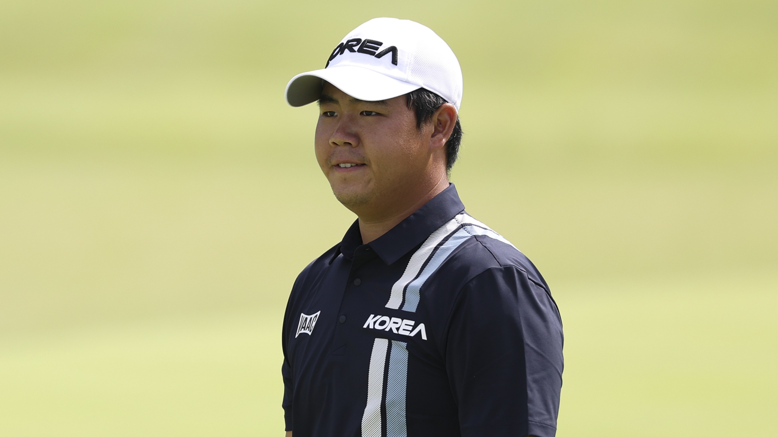 Tom Kim wearing Korea national team outfit while playing at the 2026 Asian Games in Japan