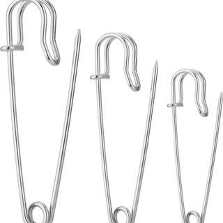 three silver safety pins left to right from large to little