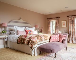 A colorful bedroom in a country home in Sussex designed by Kate Forman