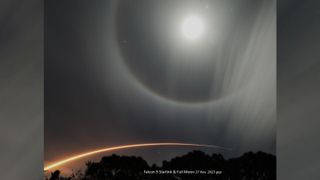A halo of light appears around the moon as a rocket streaks through the sky