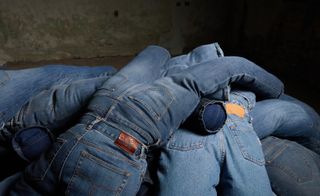 Pile of stuffed blue jeans, designed by Ana Mendieta