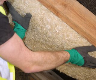 hemp insulation being fitted in a loft