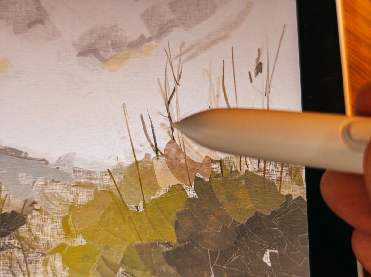 Photos of a white drawing tablet on a wooden table, the XPPen Magic Pro 13