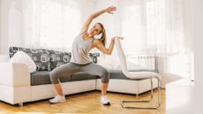 Woman exercises in domestic setting