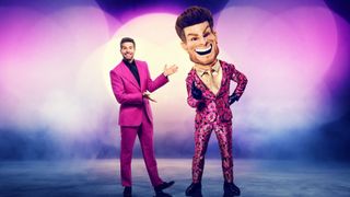 Joel Dommett standing next to Giant Joel from The Masked Singer UK 2025