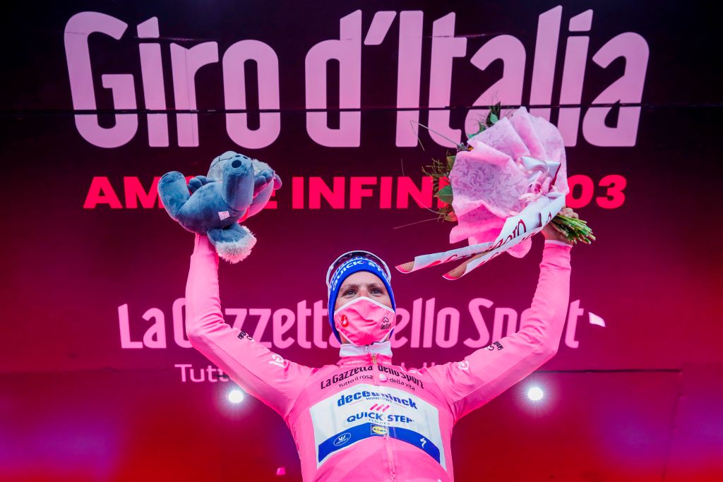 New overall leader wearing the overall leaders pink jersey Team Deceuninck rider Portugals Joao Almeida celebrates on the podium on October 5 2020 after the 3rd stage of the Giro dItalia 2020 cycling race a 150kilometer route between Enna and volcano Etna LinguaglossaPiano Provenzana Sicily Photo by Luca Bettini AFP Photo by LUCA BETTINIAFP via Getty Images